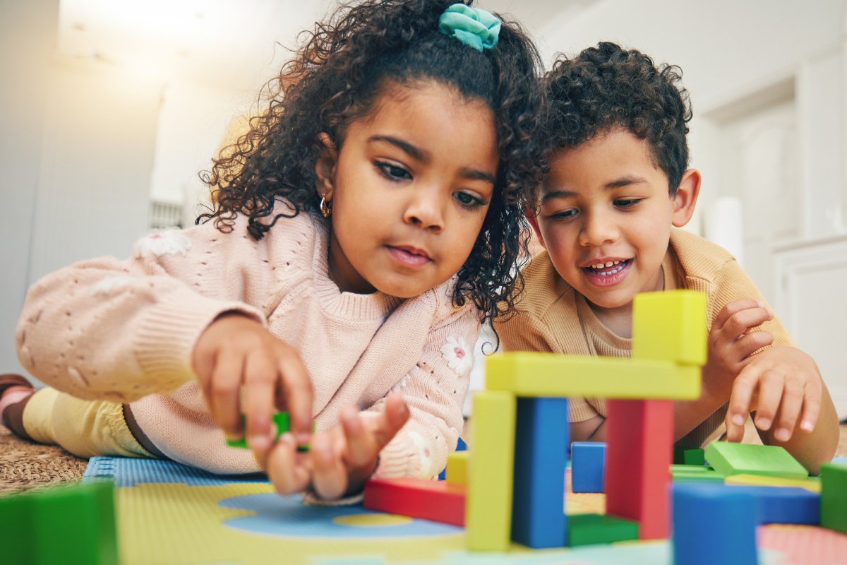 A young child learning through play with a supportive therapist