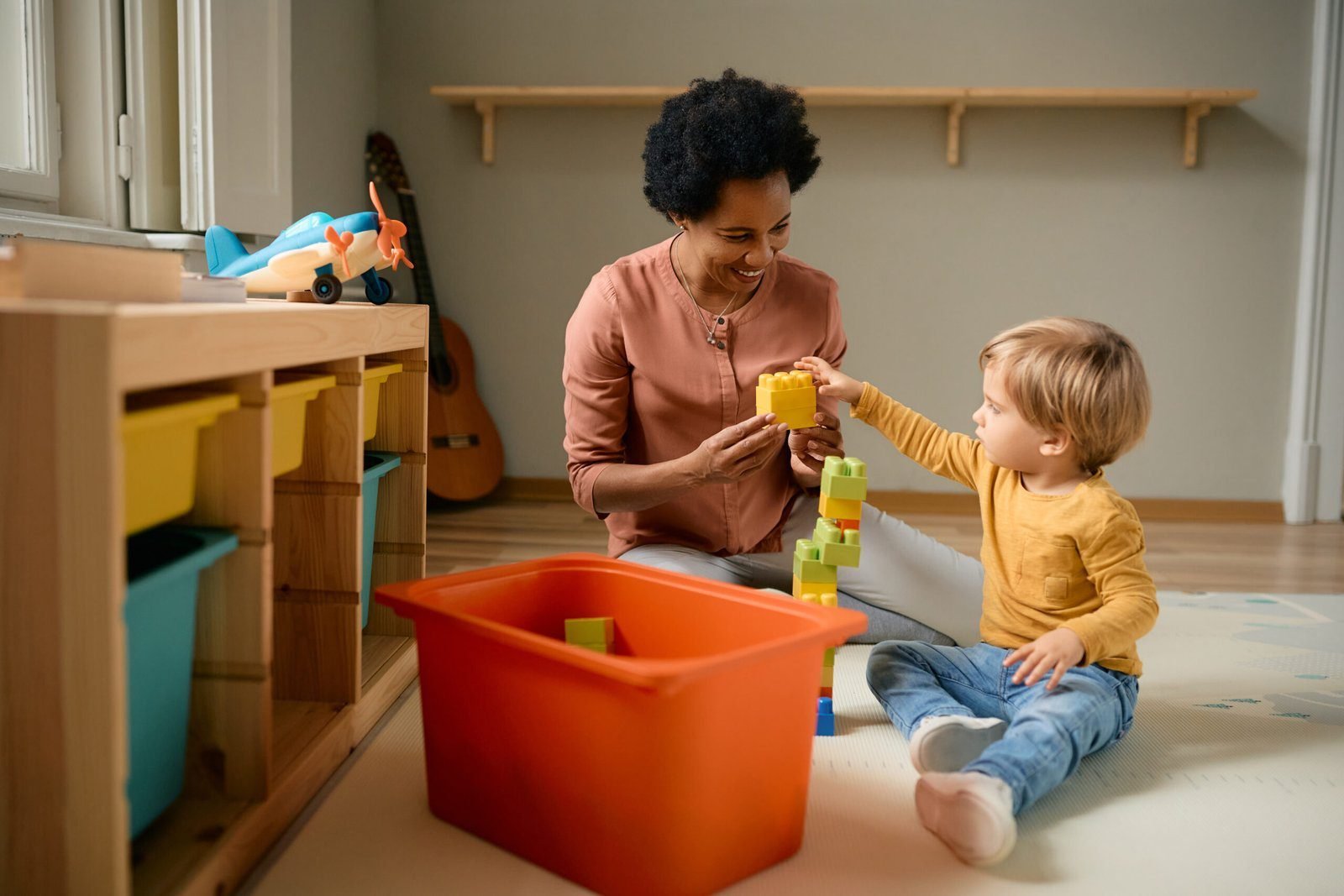 A therapist and child learning through play