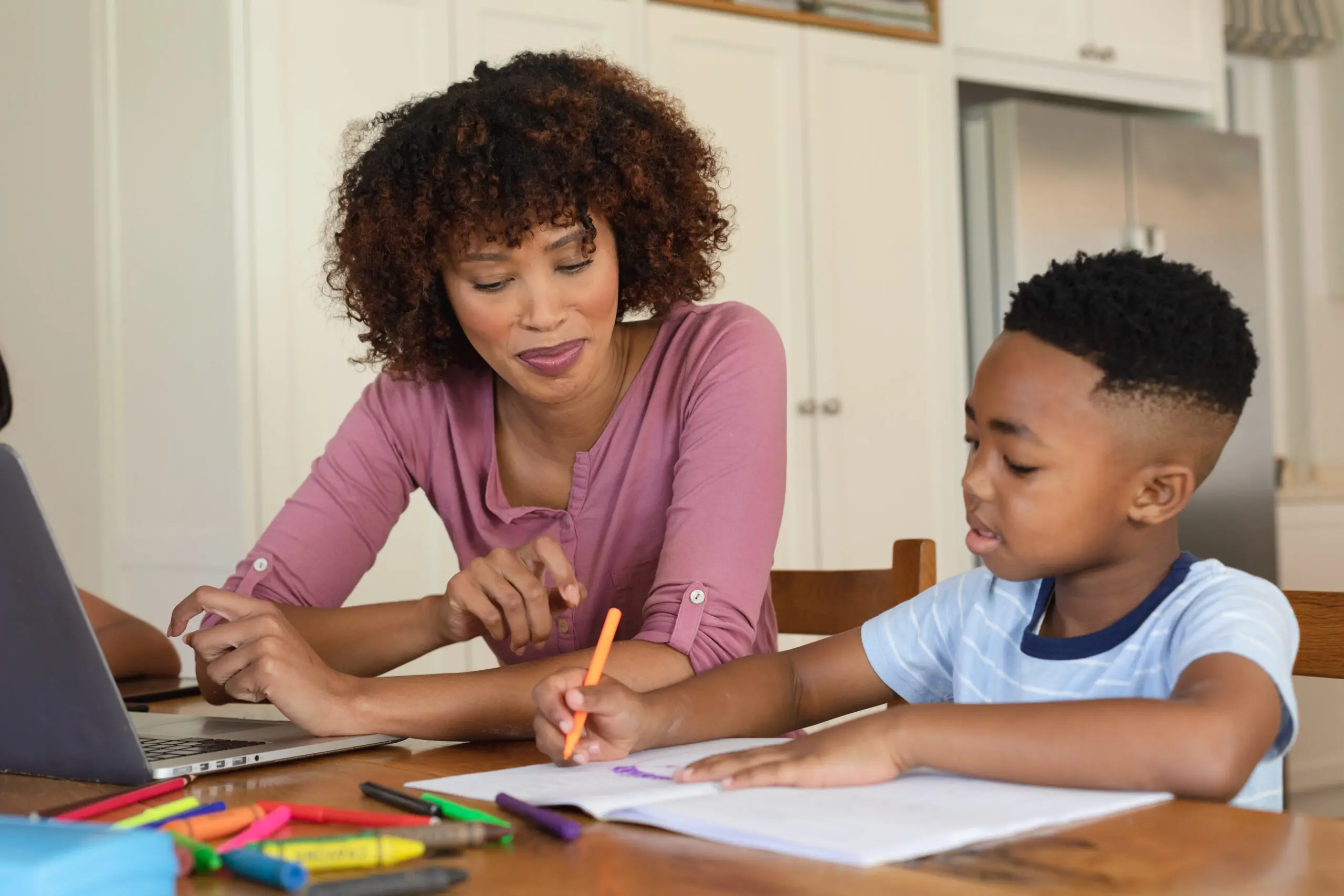 Woman and child learning together at home