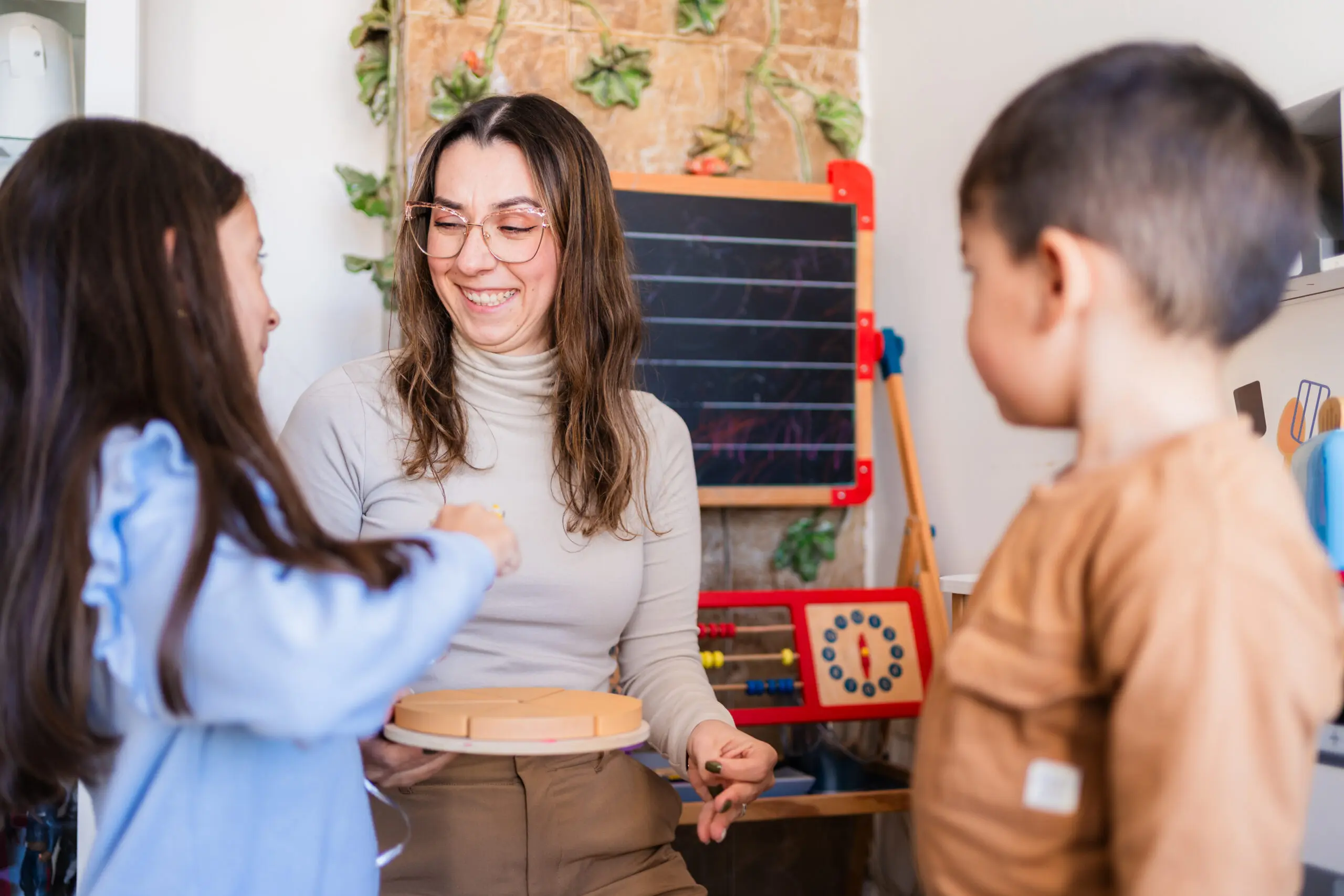 Woman teaching children with puzzle game at home