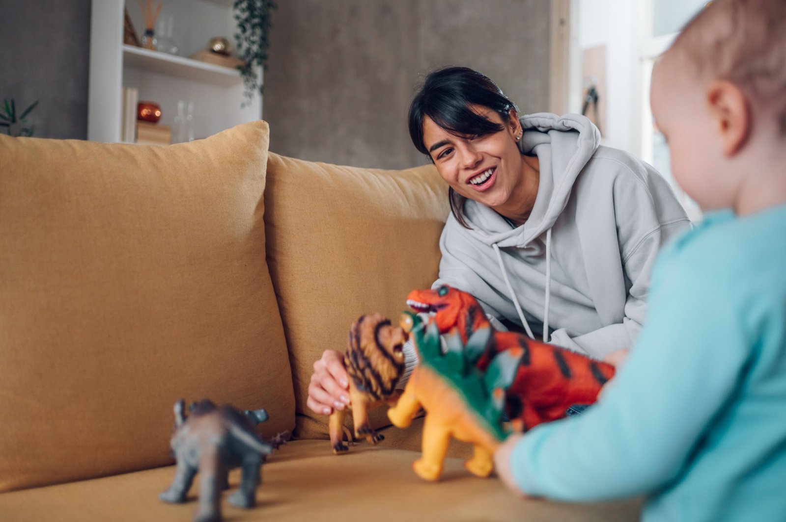 A child and caregiver playing together at home