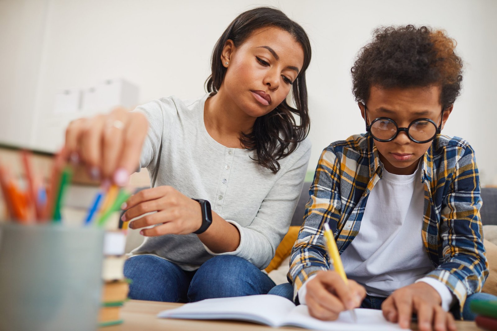 African-American Woman Helping Son with Homework African American Woman Helping Son with Homework
